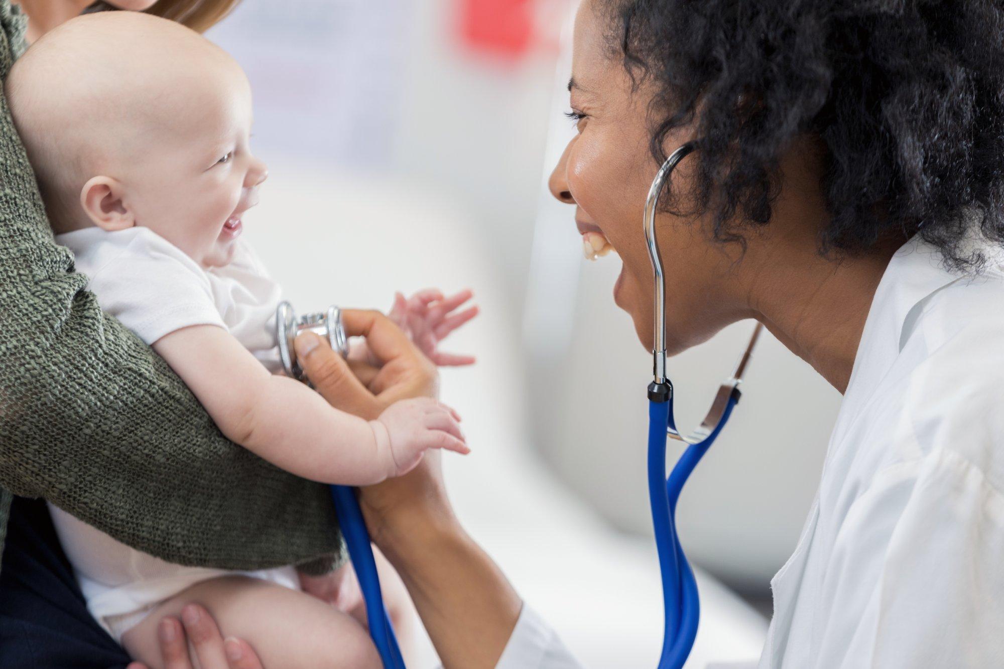 Adorable baby smiles at pediatrician