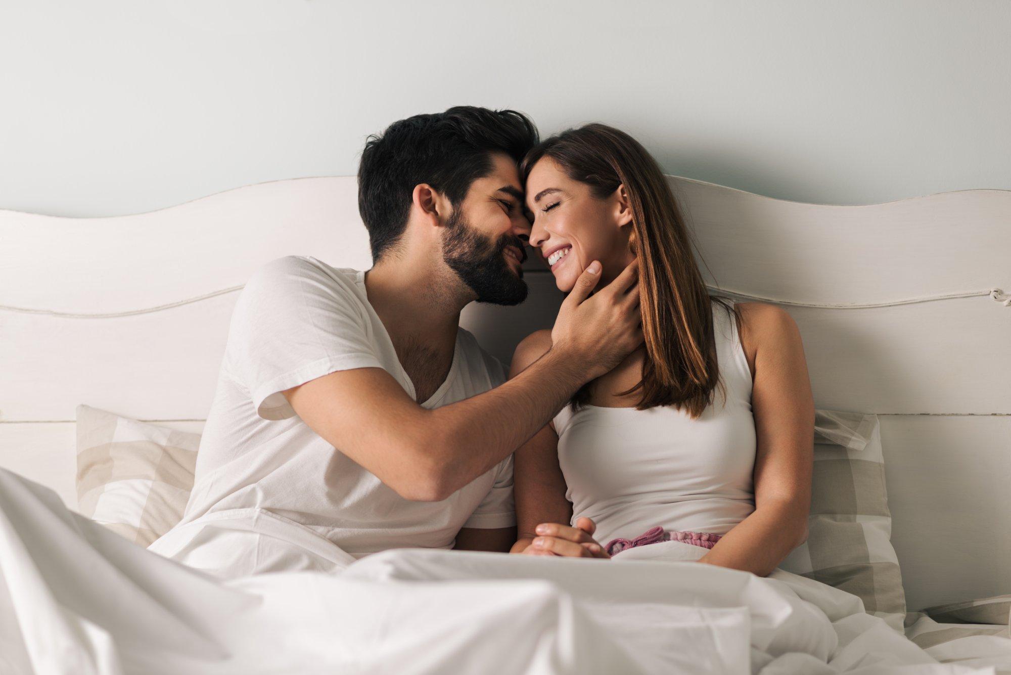 Affectionate young couple in the bedroom