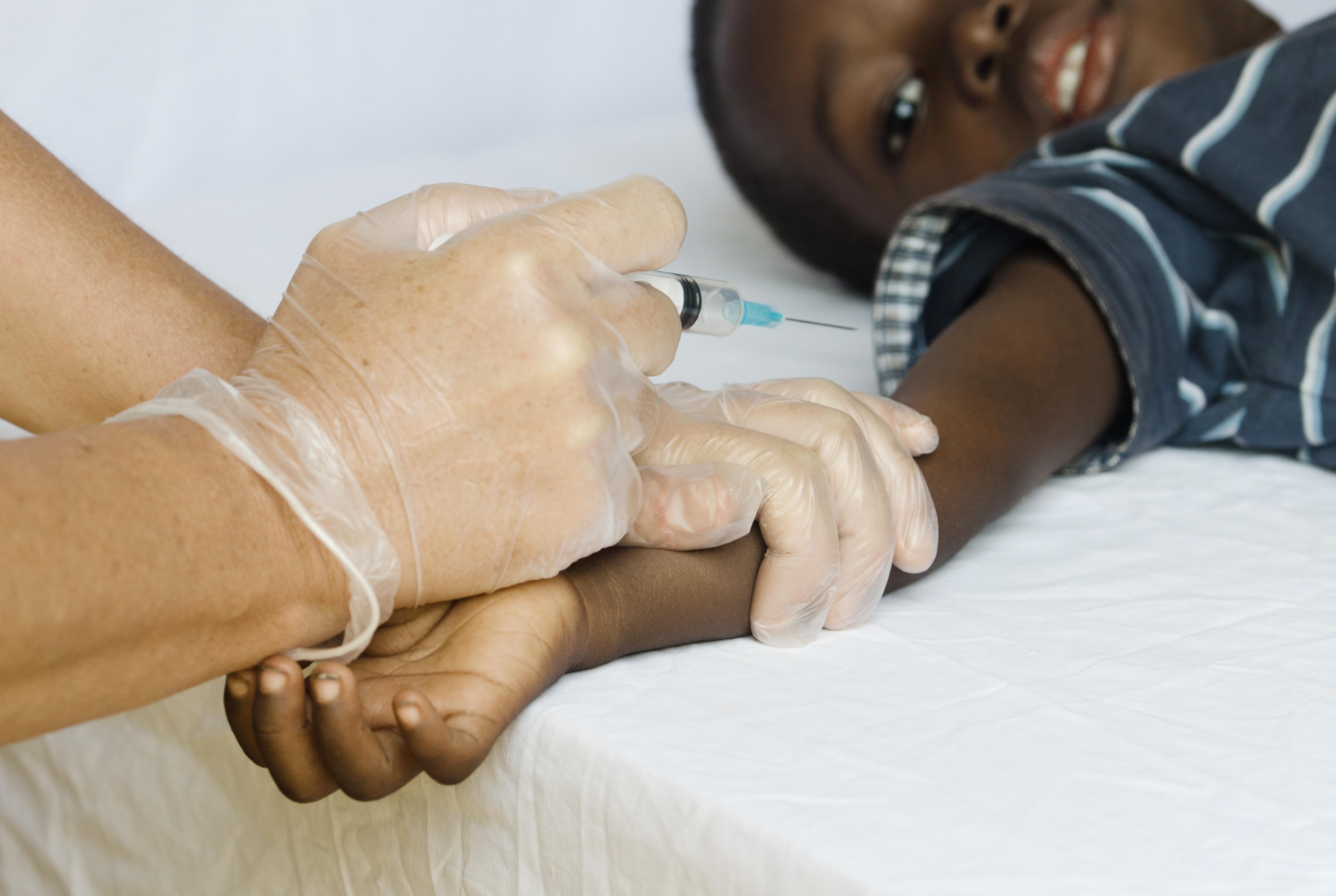 Pediatrician takes blood from a child patient. Healthcare antibody test coronavirus concept