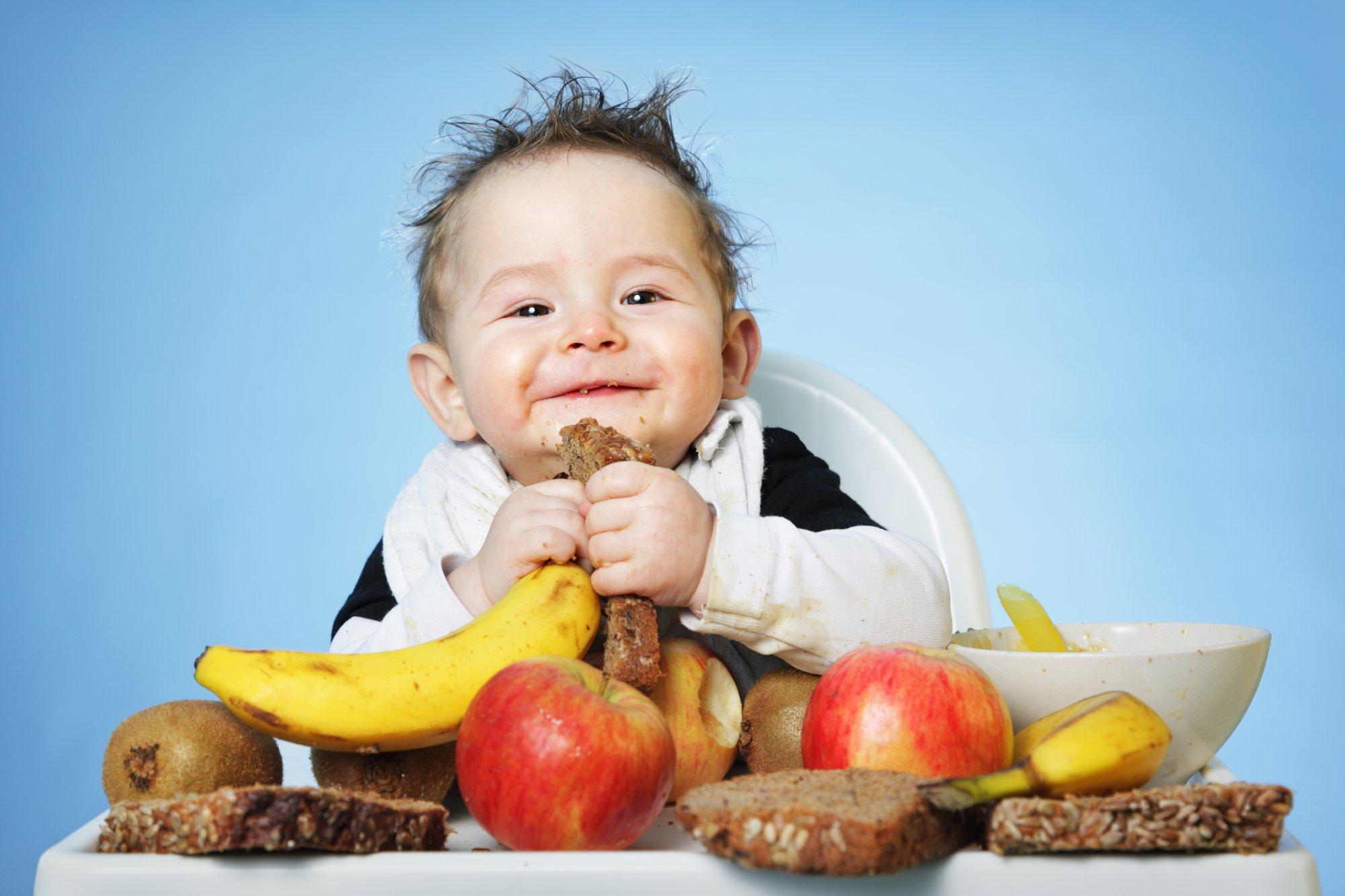 Baby boy eating healthy food for breakfast