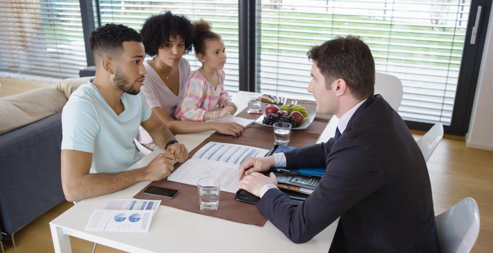 Couple discussing with banker