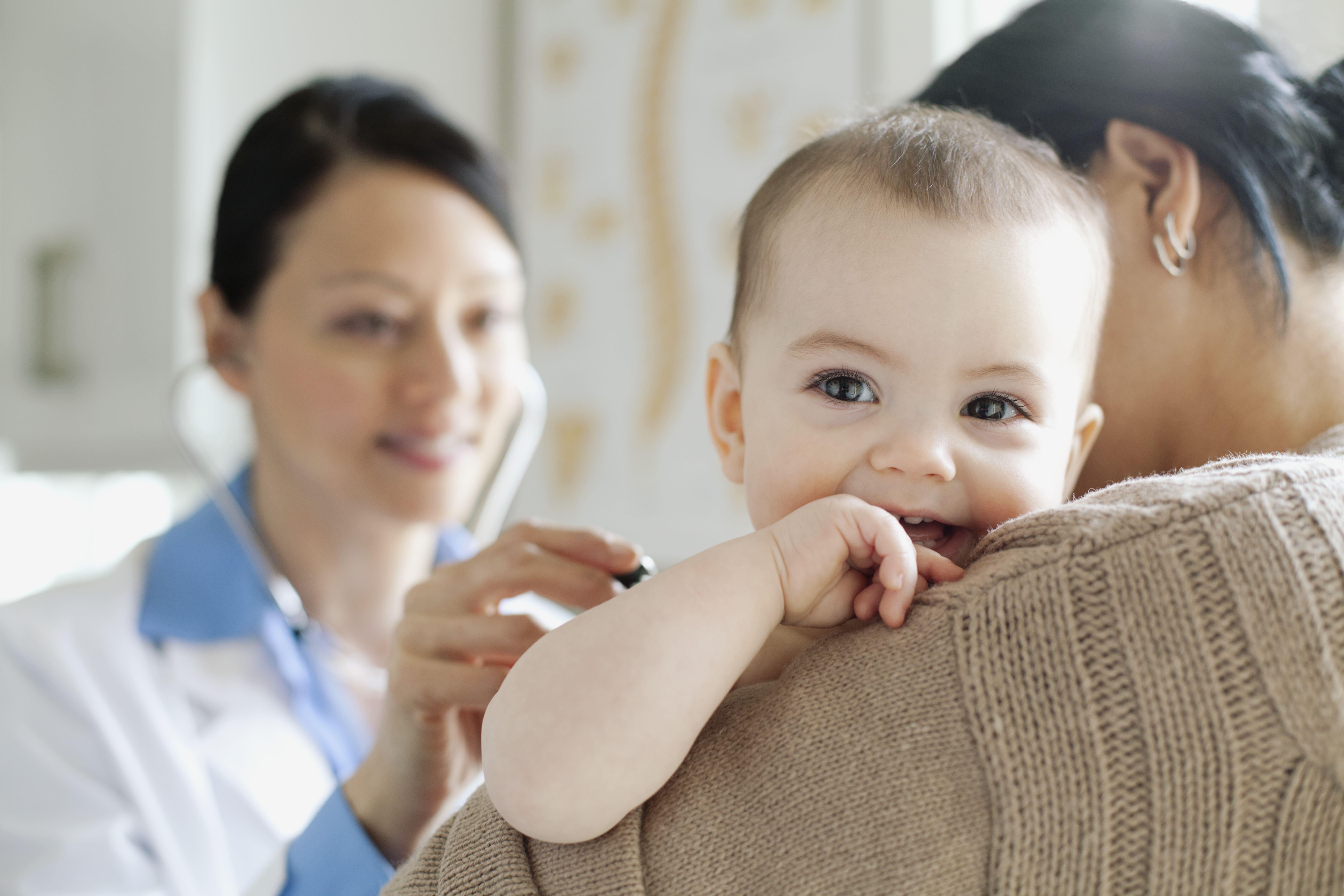 Doctor examining baby