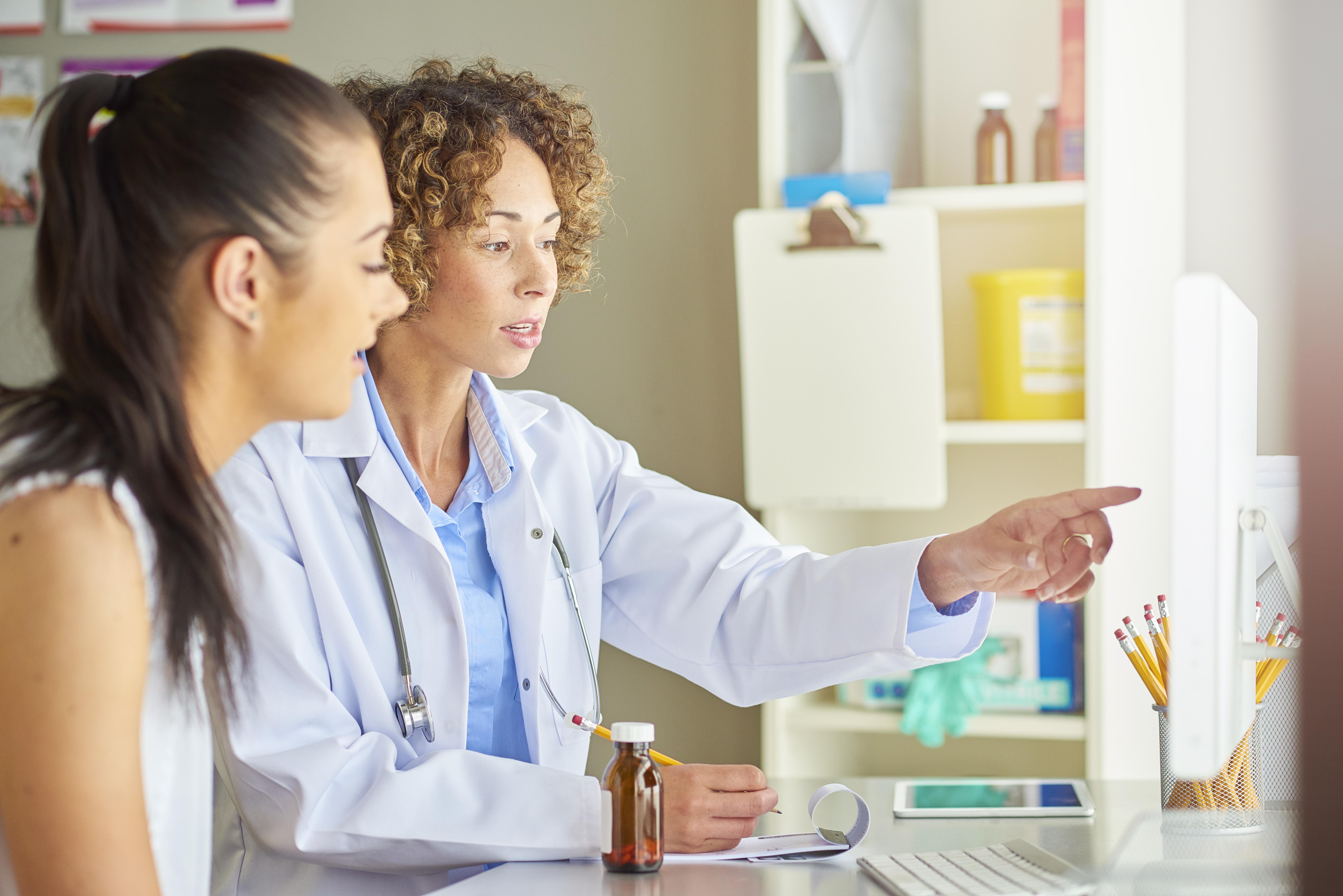 Female doctor screen diagnosis