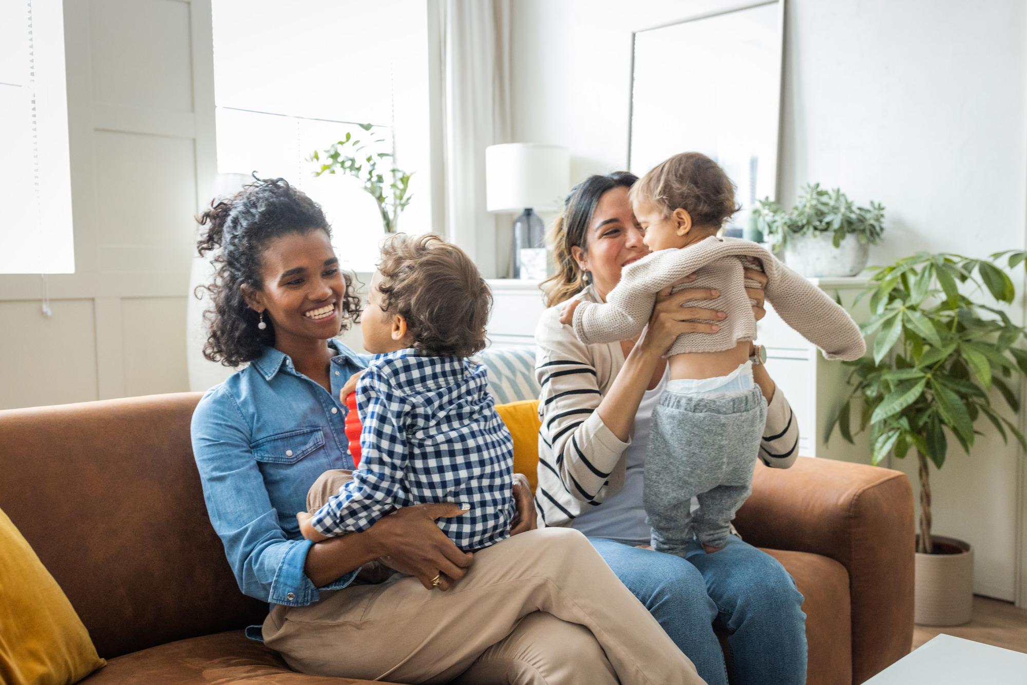 Female gay couple with kids at home