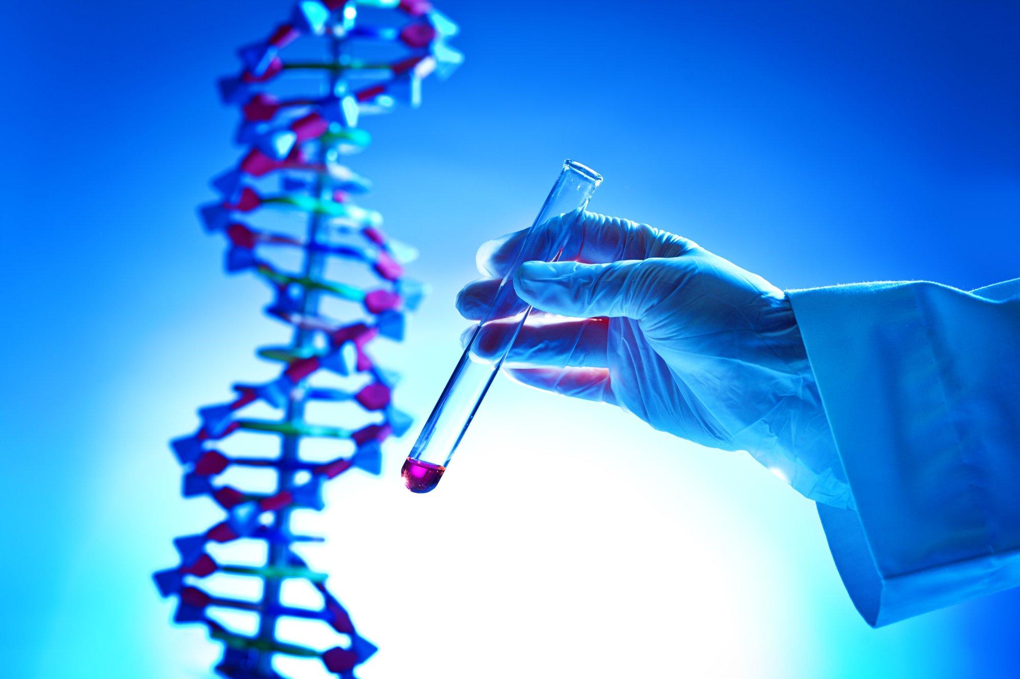 Hand Holding a Chemical Solution Test-tube in a bio-Chemistry DNA Research Laboratory