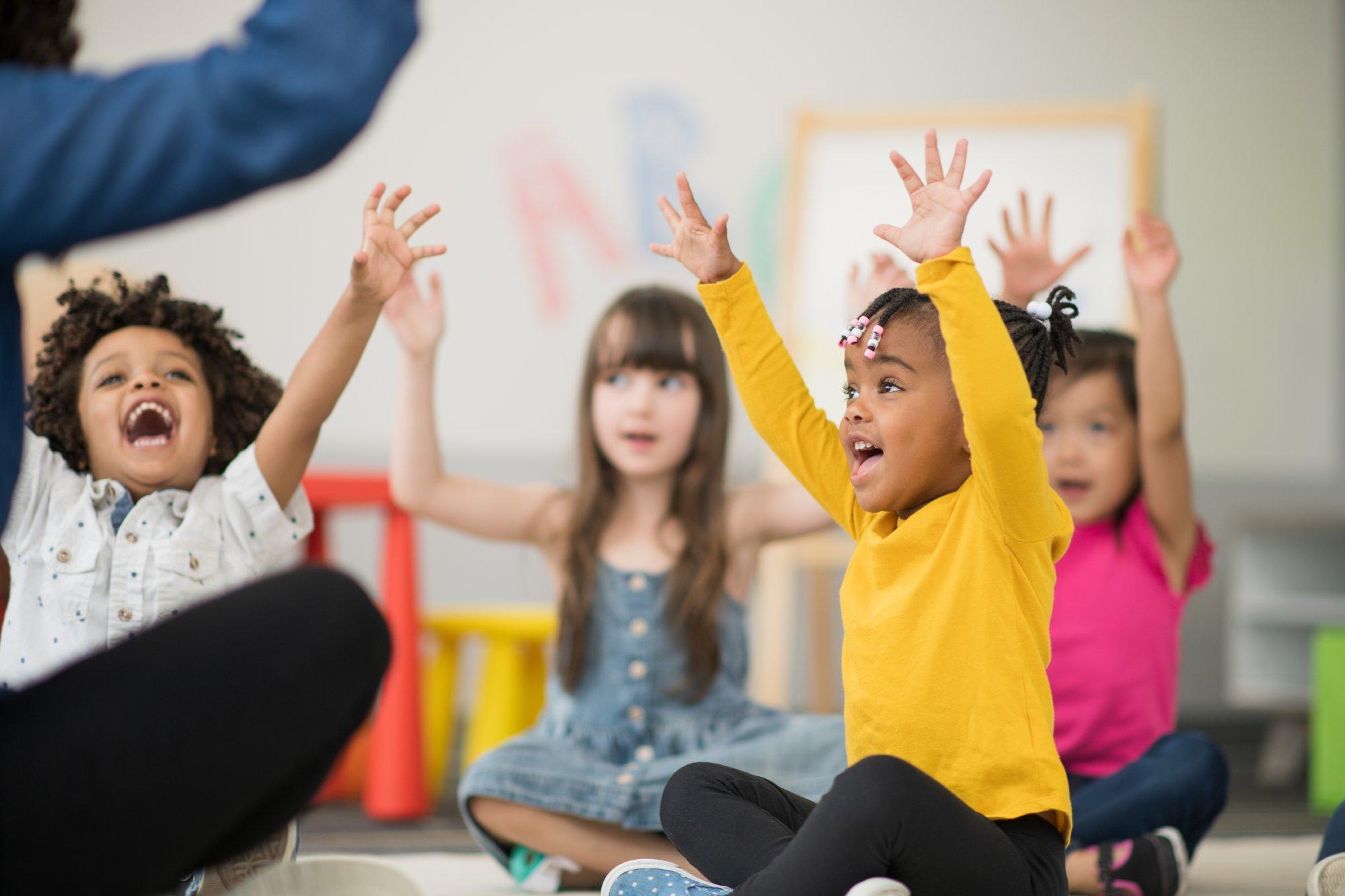 Hands up in the air preschool children