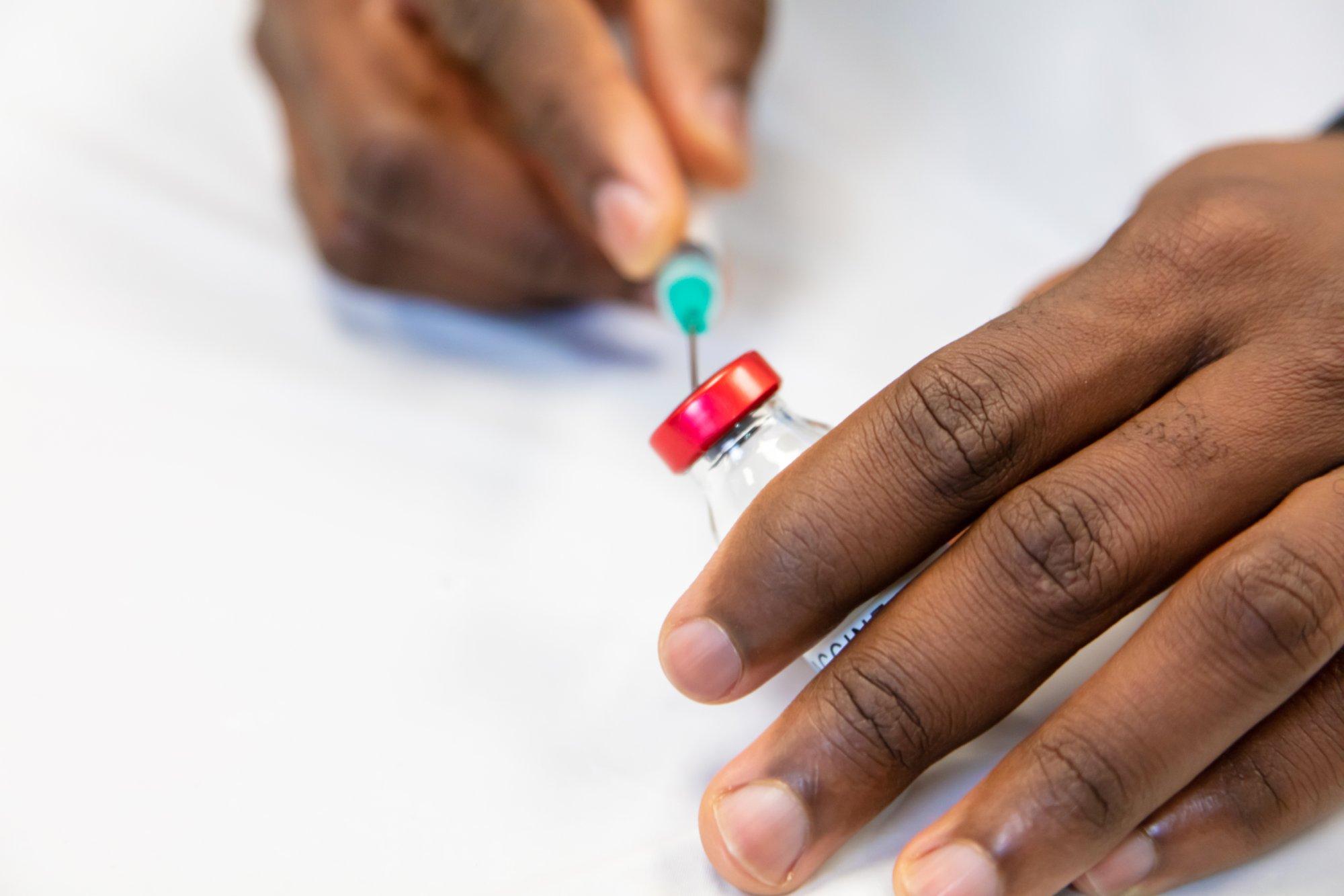 Male Black Health Care Science Professional Working with Syringe and Vaccination Photo Series