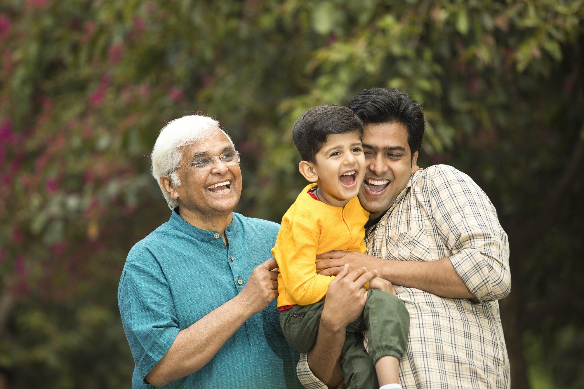 Three generation family having fun at park